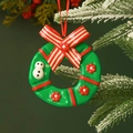 Festive Christmas wreath ornament with red bow and snowman hanging on a snowy tree branch - Bow Garland 9*10CM