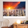 Cozy room setup with a snowy forest sunset wall tapestry hanging on a white wooden wall - 150x130cm / Sunset Snow Woods