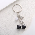 Cool black cherry pearl keychain with glossy finish on textured white background - Silver Black Cherry