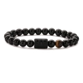 Aries zodiac stretch bracelet with black agate beads and tiger eye stone on white background - Aries