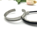 Polished silver stainless steel C-shaped open bracelet with black inlay groove detail - Square Heart Silver