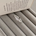 Detail of S925 silver twist band ring with square clear stone in a grey jewelry box - Adjustable Open / Silver