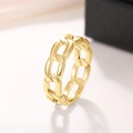 Macro shot of gold-plated curb link ring with a polished metallic finish and chain texture - US 7 / Gold