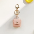 Porte-clés mini sac en cuir rose avec détails dorés élégants et poignée de luxe - Rose
