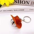 Porte-clés boule disco miroir argentée avec un chapeau de cowboy orange et anneau métal - Chapeau de Cowboy Marron / Boule à facettes de 3cm