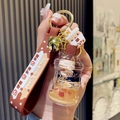 Brown bear milk tea keychain with liquid quicksand bottle and small golden bell - Bucket Cup Bear