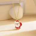 Festive gold titanium necklace featuring a red enamel Santa Claus pendant on display - Santa Claus Giving Gifts / Gold