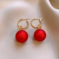 Elegant gold hoop earrings with matte red round pendants on a beige textile background - 86# Matte Ball Hoop Style (HE29310) / Gold Red