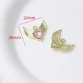 Macro shot of 22mm x 20mm pink heart wing pendant with gold finish for DIY jewelry - Style 40