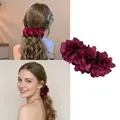 Large burgundy fabric flower banana hair clip showing side and back styling views - Burgundy