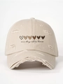 Detail of distressed beige baseball cap with heart prints and one day at a time text - Beige / Adjustable