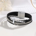 Detail of multi-layer leather bracelet with silver BLESSED cross and rhinestone inlay - Black