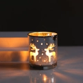 Silver glass candle holder featuring reindeer and snowflake patterns with warm inner light - Silver Elk