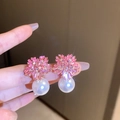 Detailed view of pink zircon flower stud earrings with a large white hanging pearl - Pink Flower Pearl Stud / Pink