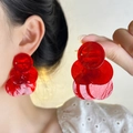 Macro detail of red layered acrylic circular disk earrings with translucent resin texture - Red Short / Red