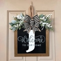 Rustic wooden welcome sign with letter J, black bow and greenery for front door decor - Letter J