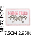 Macro detail of Mama Tried embroidery patch with pistols and pink border stitching - No.9 (MAMA TRIED)