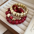 Close-up of golden metallic and red marble resin beaded bracelets in a velvet box - 11# Beaded Bracelet (HB4316)