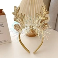 Detail of Christmas reindeer antler headband with gold sequins and colorful long tassels - Gold Sequin Antlers