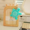 Luminous blue-green plush turtle keychain accessory hanging on a wooden photo frame - Blue-Green Style (Style 26) / 10cm