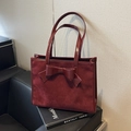 Deep burgundy faux suede tote bag featuring a large decorative bow and leather trim - Burgundy