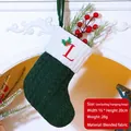 Dark green knitted Christmas stocking with white cuff and embroidered red letter L - Letter L / Dark Green