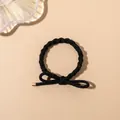 Detail of high-elastic black braided hair tie with elegant bow and gold metal tips - Braided Style / Black