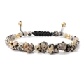 Detail van de zwarte verstelbare gevlochten koord en marmeren kralen op een vintage armband - Dalmatiër Steen (FA0381)