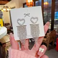 Sparkling silver S925 heart tassel earrings with dangling rhinestones on a display card - Hollow Heart Full Diamond Tassel (E0348) 925 Sterling Silver Earring Post