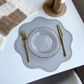 Grey scalloped faux leather placemat with waterproof finish on white tabletop - Flower / Beige Grey