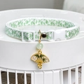 Close-up of pet collar with green bamboo leaf print, white buckle and oriental fan charm - Bamboo Leaf