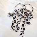 Elegant silver bow earrings with black and white floral chiffon ribbon on silk background - Black & White Floral