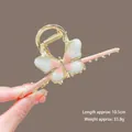 Close-up of golden butterfly hair claw clip with pink gradient wings and 10.5cm scale - K111 Pink Butterfly