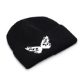Black knit beanie with white butterfly jacquard pattern in a classic cuffed ribbed style - Black