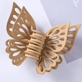 Detail of matte beige butterfly hair claw clip with hollow wings on a neutral background - 15CM / Khaki