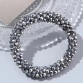Elegant silver faceted bead hair tie displayed on an embossed decorative glass plate - Silver