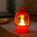 Macro detail of red vintage LED lantern glowing on music sheet with holiday decor - Red