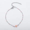 Detail of pink daisy pendant on a silver beaded chain with adjustable lobster clasp - Steel + Pink