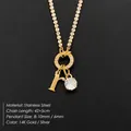Gold-plated stainless steel necklace featuring letter R pendant and a sparkling round rhinestone - Letter R