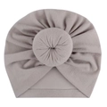 Soft dusty rose baby turban hat with a large cute donut knot on a plain white background - One Size / Gray