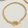 Golden snake chain bracelet with textured toggle clasp and minimalist metal finish - Toggle Clasp Bracelet Gold