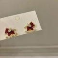 Close-up of 18K gold plated horse stud earrings with red enamel and crystals details - 925 Silver Needle / Rocking Horse Stud Earrings / Gold Red