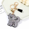 Cute Shiba Inu rhinestone keychain with black tassel and golden bell on a white tray - Black & White Stripe