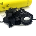 Close-up of black lace masquerade mask with intricate floral embroidery and sequins - One Size / Black