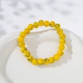 Beaded yellow volcanic stone crown bracelet with black spiderweb patterns - Yellow Black Texture