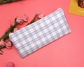 Flat lay of light blue plaid canvas pencil case with metal zipper on a pink background - Sea Salt White Plaid