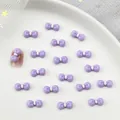 Schattige paarse hars strikjes met witte kralen voor DIY manicure decoratie - Paars