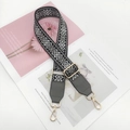 Detail of geometric woven bag strap with adjustable gold metal buckle and hooks - Black Base Grey with Dark Grey Leather