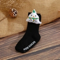 Detail of baby socks with plush cartoon ghost decoration on rustic wood background - XS / Black Little Ghost