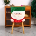 Detailed view of Santa chair cover with green sequins and plush beard for holiday decor - Santa Claus